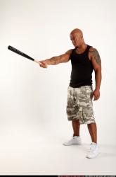 Man Adult Athletic Black Standing poses Sportswear Fighting with bat