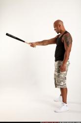Man Adult Athletic Black Standing poses Sportswear Fighting with bat