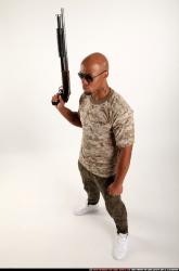 Man Adult Athletic Black Standing poses Army Fighting with shotgun