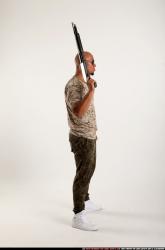 Man Adult Athletic Black Standing poses Army Fighting with shotgun