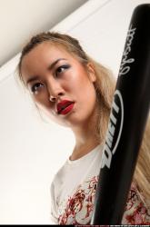 Woman Young Average Standing poses Casual Asian Fighting with bat