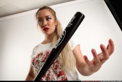 Woman Young Average Standing poses Casual Asian Fighting with bat