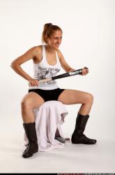 Woman Adult Athletic White Sitting poses Casual Fighting with bat