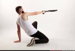 Man Adult Athletic White Kneeling poses Casual Fighting with shotgun