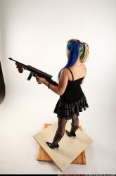 Woman Young Average White Fighting with submachine gun Standing poses Casual