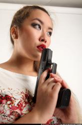 Woman Young Average Fighting with gun Standing poses Casual Asian