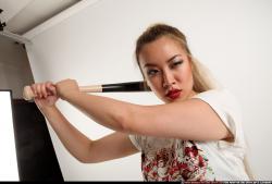 Woman Young Average Standing poses Casual Asian Fighting with bat