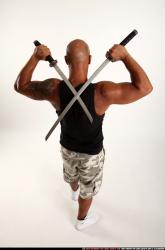 Man Adult Athletic Black Fighting with sword Standing poses Sportswear