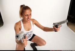 Woman Adult Athletic White Fighting with gun Kneeling poses Sportswear