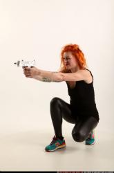 Woman Adult Athletic White Fighting with submachine gun Kneeling poses Casual