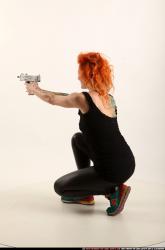 Woman Adult Athletic White Fighting with submachine gun Kneeling poses Casual