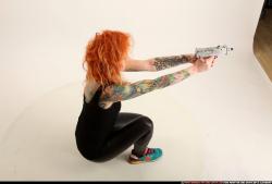 Woman Adult Athletic White Fighting with submachine gun Kneeling poses Casual