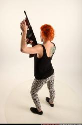 Woman Adult Athletic White Fighting with submachine gun Standing poses Casual