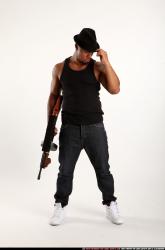 Man Adult Athletic Black Fighting with submachine gun Standing poses Casual