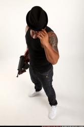 Man Adult Athletic Black Fighting with submachine gun Standing poses Casual