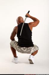 Man Adult Athletic Black Fighting with sword Kneeling poses Army