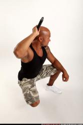 Man Adult Athletic Black Fighting with sword Kneeling poses Army