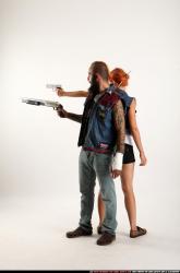Man & Woman Adult Athletic White Standing poses Casual Fighting with shotgun