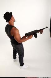 Man Adult Athletic Black Fighting with submachine gun Standing poses Casual