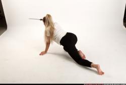 Woman Young Average Fighting with sword Kneeling poses Casual Asian