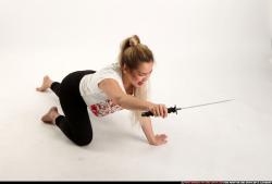 Woman Young Average Fighting with sword Kneeling poses Casual Asian