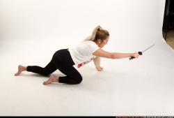 Woman Young Average Fighting with sword Kneeling poses Casual Asian