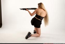 Woman Young Average Kneeling poses Casual Asian Fighting with shotgun