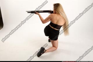 2016 09 KAYA KNEELING AIMING SHOTGUN 02 A