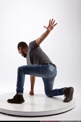 Man Adult Athletic Neutral Kneeling poses Sportswear Latino