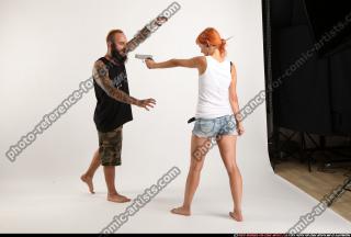 couple5-pistol-defend-zombie-attack