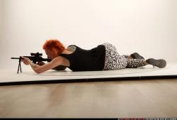 Woman Adult Athletic White Fighting with submachine gun Laying poses Casual