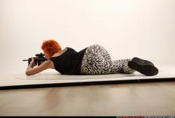 Woman Adult Athletic White Fighting with submachine gun Laying poses Casual