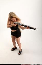 kayaa-standing-aiming-shotgun