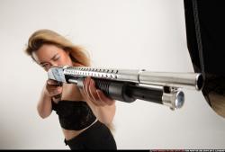 kayaa-standing-aiming-shotgun