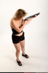 kayaa-standing-aiming-shotgun