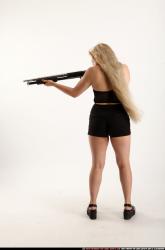 kayaa-standing-aiming-shotgun