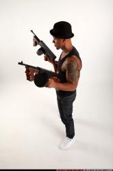 Man Adult Athletic Black Fighting with submachine gun Standing poses Casual