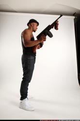 Ron-tommyguns-pose1