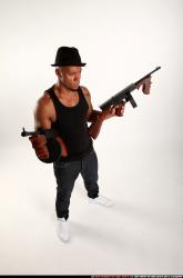 Ron-tommyguns-pose1