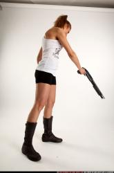 Woman Adult Athletic White Sitting poses Casual Fighting with shotgun