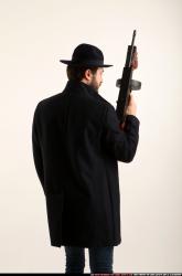 Man Adult Athletic White Fighting with submachine gun Standing poses Coat