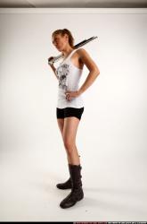 Woman Adult Athletic White Standing poses Casual Fighting with shotgun