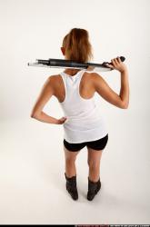 Woman Adult Athletic White Standing poses Casual Fighting with shotgun