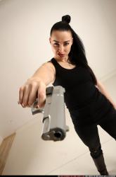 claudia-standing-aiming-pistol 