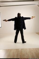 Man Old Average White Fighting with gun Standing poses Coat