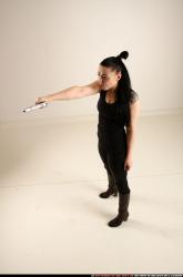 claudia-standing-threatening-pistol