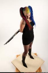 dolores-uzi-shotgun-crossed-behind-back