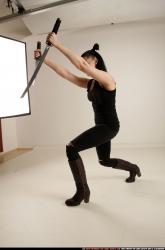 Woman Adult Athletic White Fighting with sword Standing poses Casual