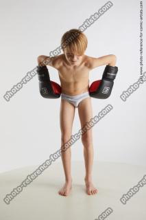 standing young boy with box gloves novel 01