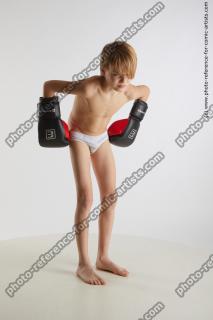 standing young boy with box gloves novel 08